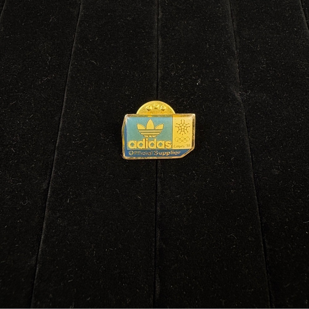 Vintage 1988 Calgary Winter Olympics Adidas Official Sponsor Lapel Pin Badge